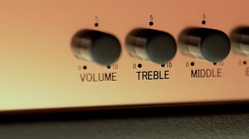 Close-up Of Amplifier Head Controller. Volume, treble, middle and Bass knobs