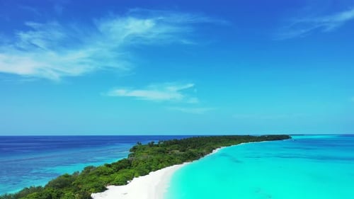 Daytime fly over island view of a paradise sunny white sand beach and aqua turquoise water backgroun