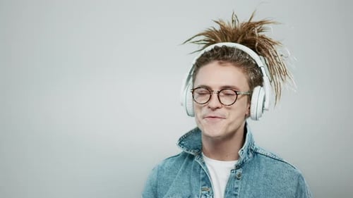 Man Dancing to Music with Headphones