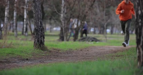 Male Legs Jogging Running in a Park Slow Motion