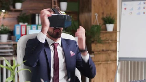 Man Uses VR Headset in Modern Office Setting