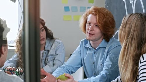 Readhead Man Talking with Colleague at Office Meeting