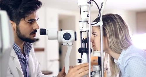 Woman Getting Eye Exam by an Eye Doctor