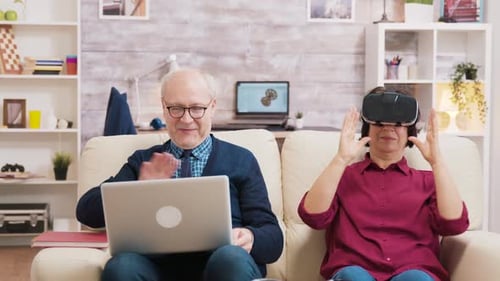 Senior Couple Exploring Virtual Reality Technology at Home