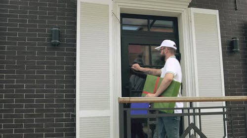 Delivery Man Handing a Gift to a Young Woman