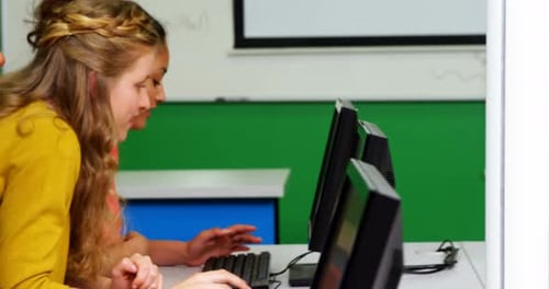 Teen Students Working on Computers in Classroom