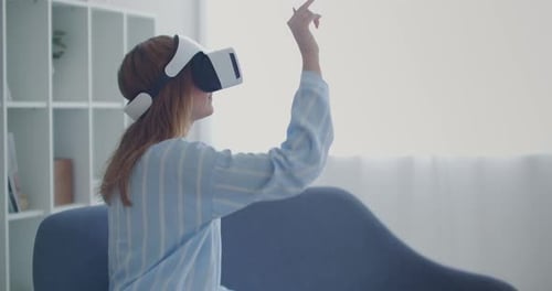 Woman Uses VR Headset in Bright Living Room