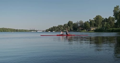 Rowing Team Training on Calm River Waters