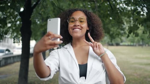 Woman Taking Selfie in the Park on Smartphone