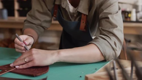 Woman Crafting Leather in Workshop Mid Shot
