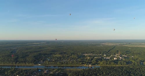 Aerial View of Forest, River, and Hot Air Balloons
