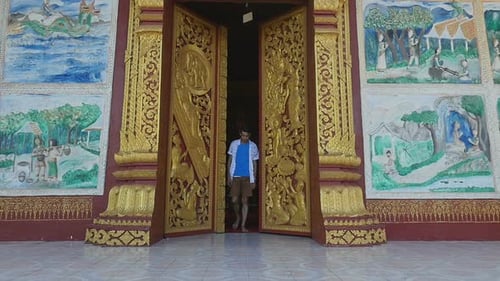Temple's Door Opening And Man Walking Out