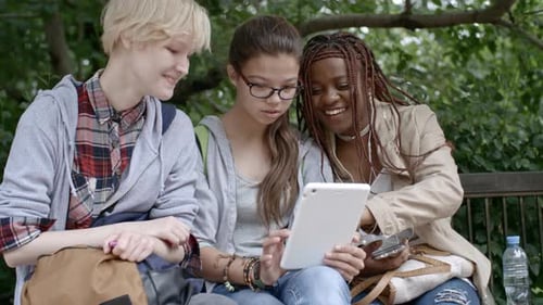 Girls Taking Picture with Tablet in Park