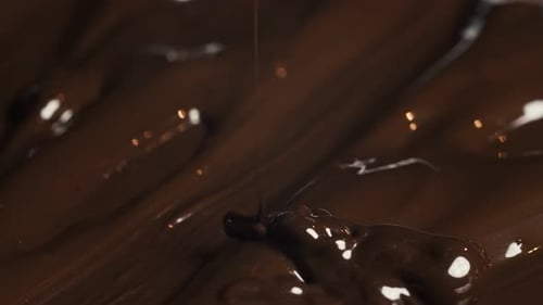 Pouring Melted Dark Chocolate Close Up