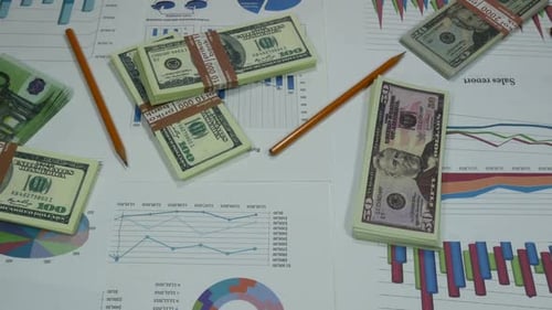 Business Graphs And Money In A Modern Office