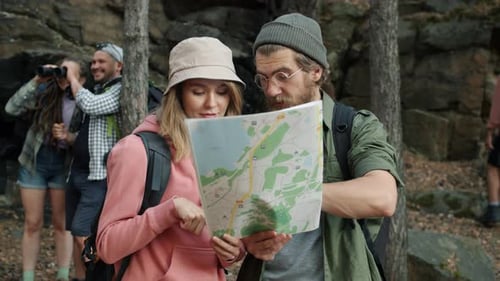 Group of Friends Hiking Together Looking at Map