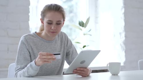 Woman Shopping Online With Tablet and Credit Card