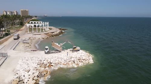 Construction Equipment Unloading Coastline Aerial