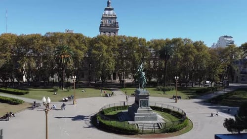 Aerial view of the square with old trees famous building and people enjoying the sunshine afternoon