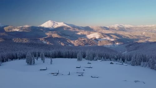 Flying Over Small Village in Carpathians Mountains