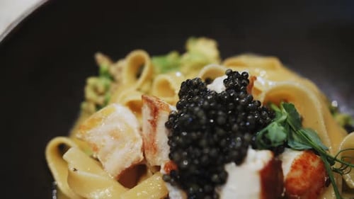 Pasta with Seafood and Black Caviar Close Up