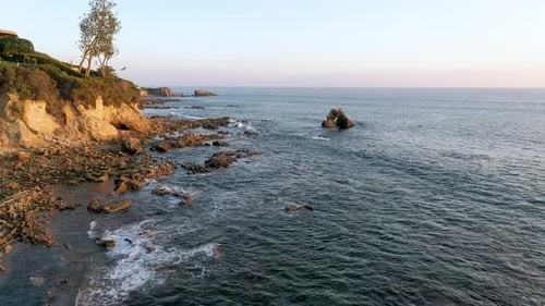 Flying over the beautiful Laguna Beach tide pools at Sunset in California.