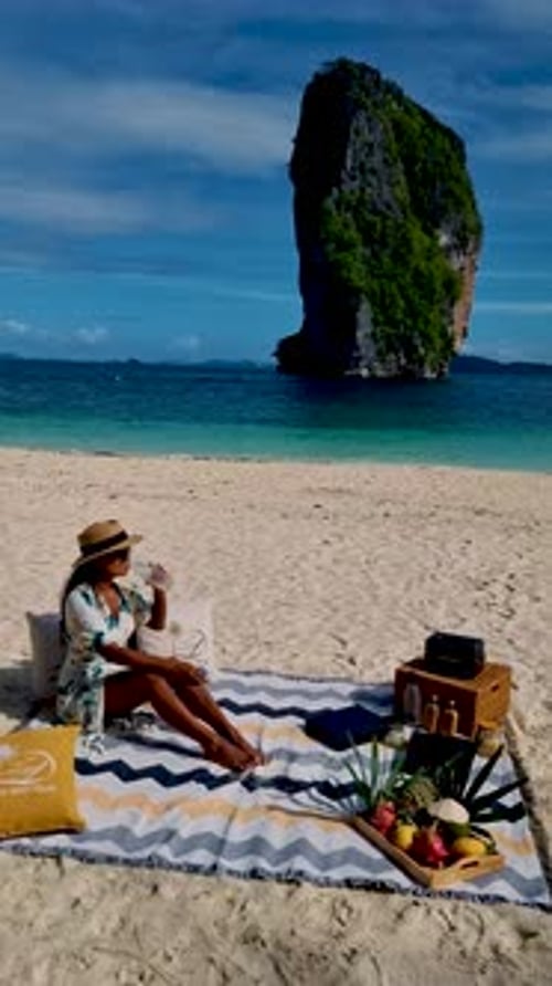 Koh Poda Krabi Thailand Asian Woman and European Men Having a Picnic on the Tropical Beach of Koh