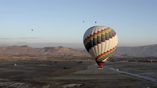 Scenic Hot Air Ballooning in Desert Landscape
