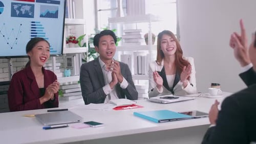 Business Team Celebrates Success in Modern Office