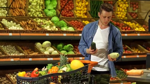 Guy Chooses Marrow at the Supermarket