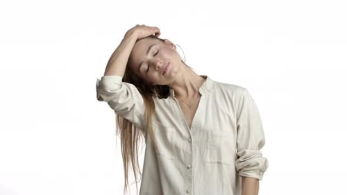 Beautiful Woman Posing with Hair Against White Background