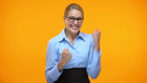 Excited Business Woman Showing Success Gesture Orange Background, Career Goal