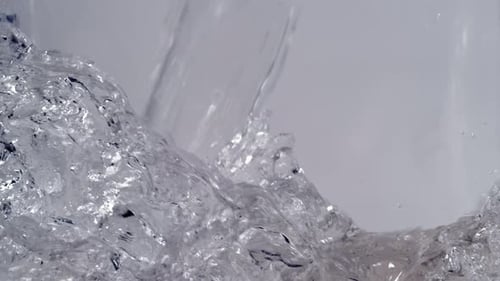 Turbulent, Clear Water Pouring in Close Up