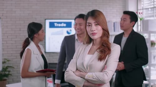 Confident Businesswoman Smiles at a Meeting