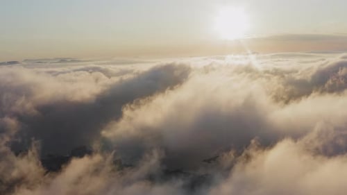 View From a Drone of City Center Above Which Clouds are Rapidly Floating
