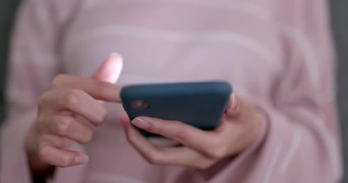 Young Adult Using Mobile Phone, Close Up