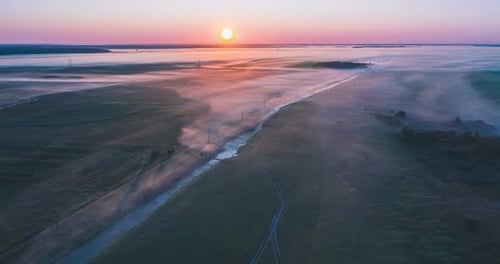Fog in the Morning in the Fields Spreads Out of the River