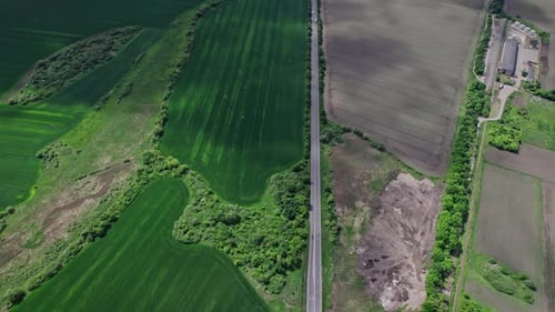 Aerial View of Road Passing Through a Rural Landscape