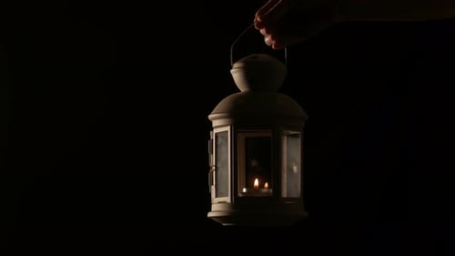 Holding Christmas Lantern