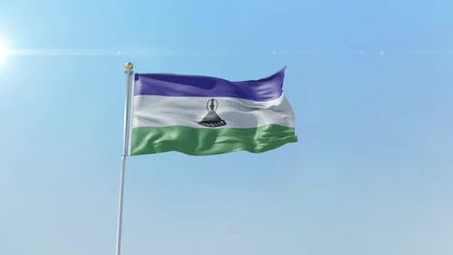 Lesotho National Flag Waving Against Clear Blue Sky