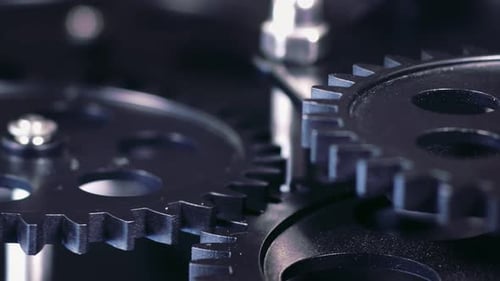 Gears Turning in Abstract Mechanical Close Up