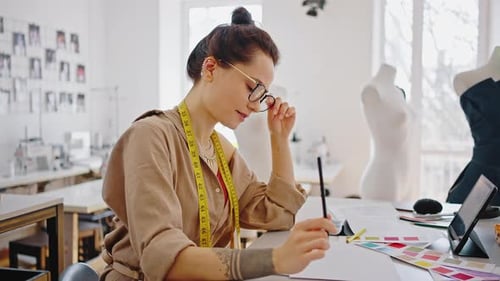 Fashion Designer Drawing at Studio Workplace