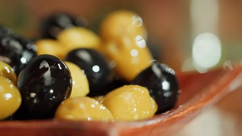 Olive Oil Black and Green Oilves on Brown Background Closeup