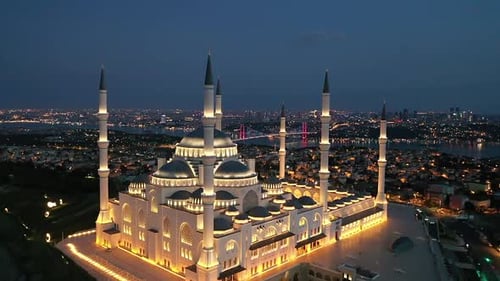 Glowing Mosque at Twilight Aerial View