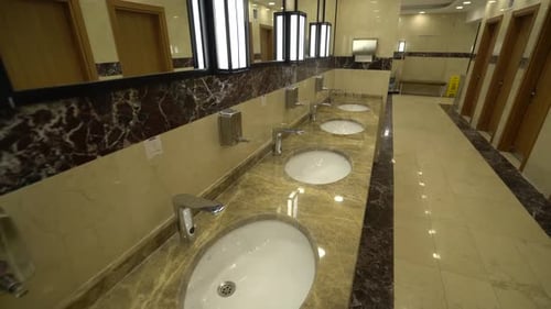 Modern Public Restroom Interior With Sinks And Mirrors