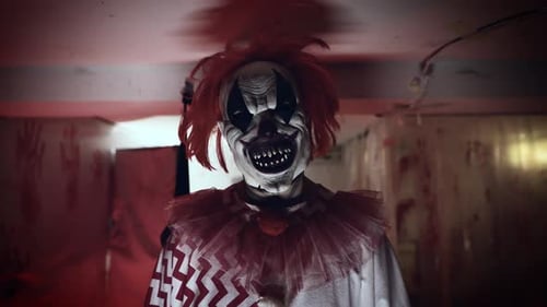 Menacing Clown in Scary Red Lit Room