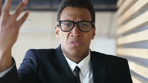 Young Professional Expressing Disagreement in a Workplace Setting