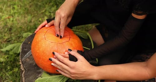 Daughter and Mother Hands Open Lid Pumpkin, Before Carving for Halloween