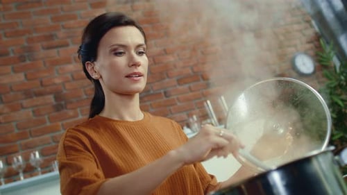 Woman Cooking Healthy Food at Home in Kitchen