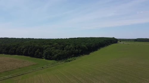 Aerial drone view of a flying over the rural agricultural landscape.